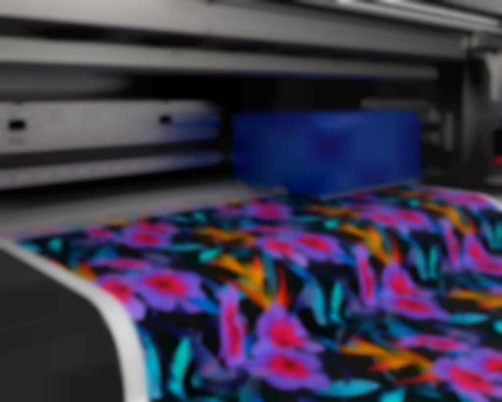 Een speciale kopconfiguratie op de Monna Lisa maakt het mogelijk de pretreatment vloeistof in-line aan te brengen op het textiel.